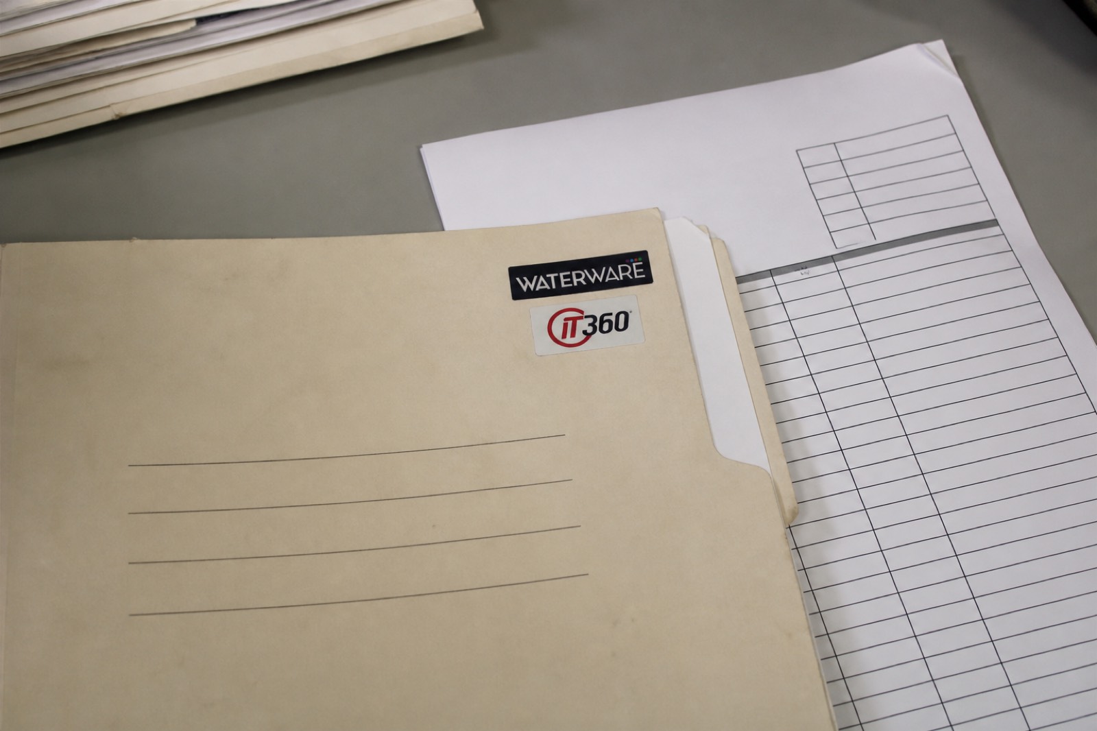 Invoice folder with Waterware and IT360 marks
